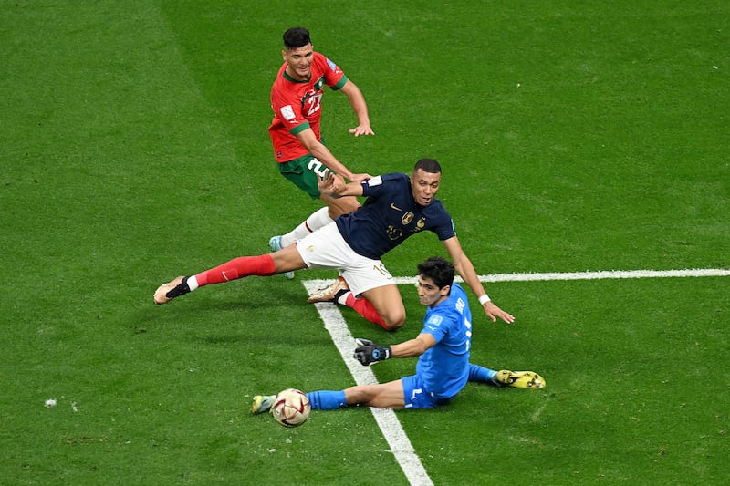 Kylian Mbappe is challenged by Yassine Bounou and Achraf Dari. Getty