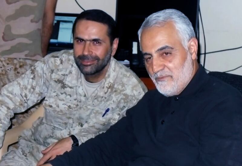 Senior Hezbollah commander Wissam Tawil, left, who was killed in southern Lebanon on Monday, pictured with Maj Gen Qassem Soleimani, who was killed in Baghdad by a US drone strike in January 2020. Hezbollah Military Media via AP