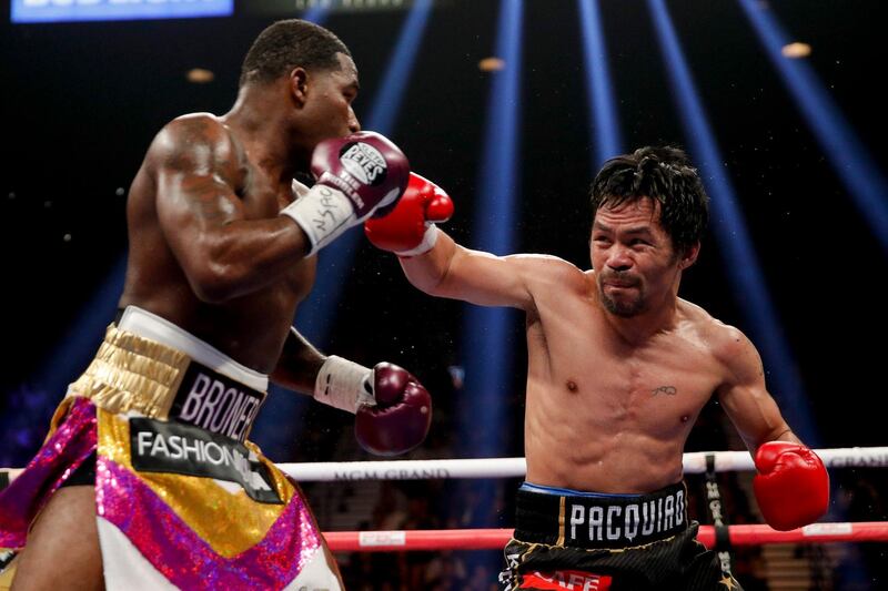 Manny Pacquiao throws a right to Adrien Broner. AP Photo