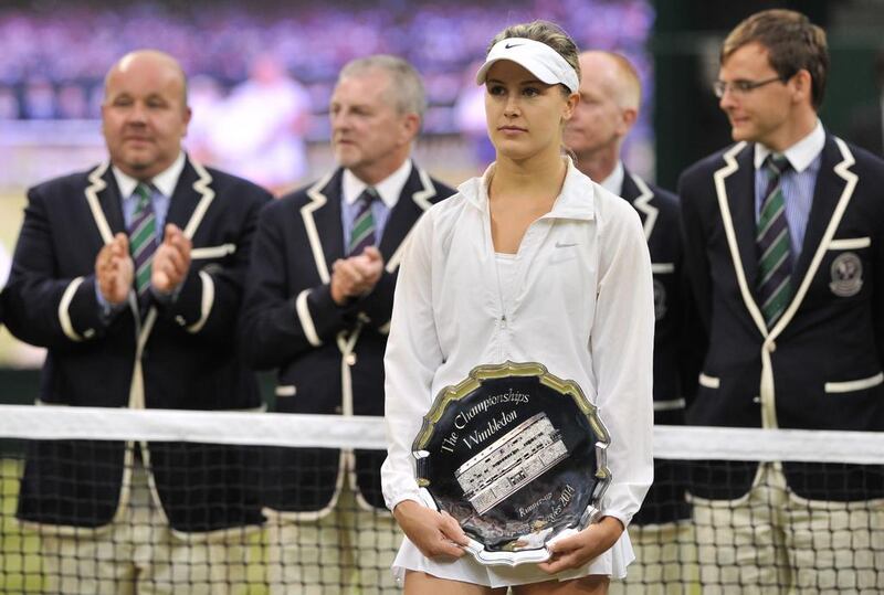 Runner-up Eugenie Bouchard holds her trophy after losing to Petra Kvitova in the 2014 Wimbledon women's singles final on Saturday. Glyn Kirk / AFP