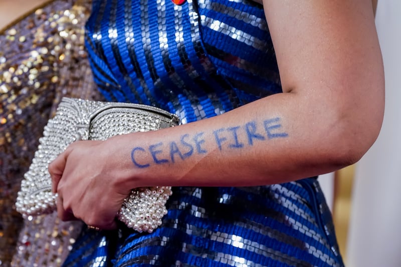 Besides wearing the red pin, Ganguly also had the words 'Cease Fire' written on her arm as she arrived for the 96th annual Academy Awards ceremony. EPA