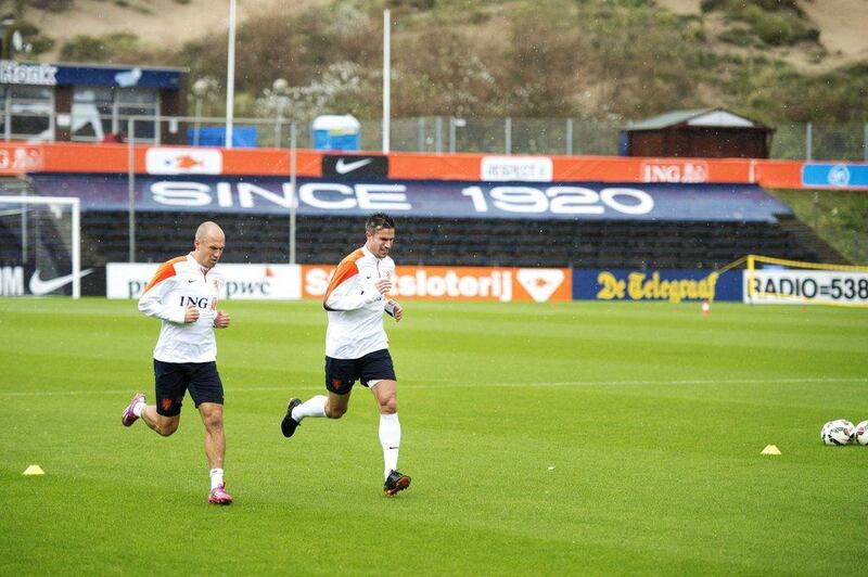 Arjen Robben, left, and Robin van Persie, right, of the Netherlands train on Tuesday ahead of Euro 2016 qualifying matches against Kazakhstan and Iceland. Olaf Kraak / EPA / October 7, 2014