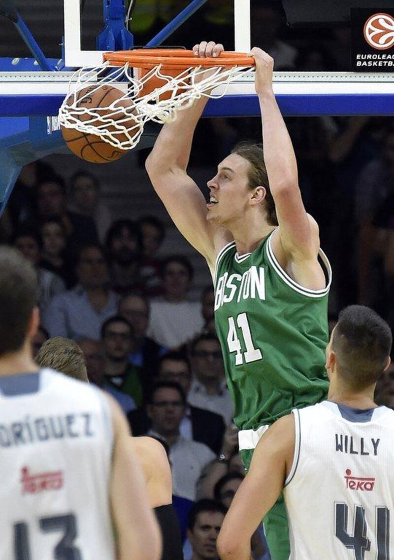 Boston Celtics centre Kelly Olynyk dunks during his team’s pre-season game on Thursday night against Real Madrid. Gerard Julien / AFP