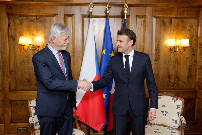 Mr Macron shakes hands with the Czech Republic's President-elect Petr Pavel, during a bilateral meeting. AFP