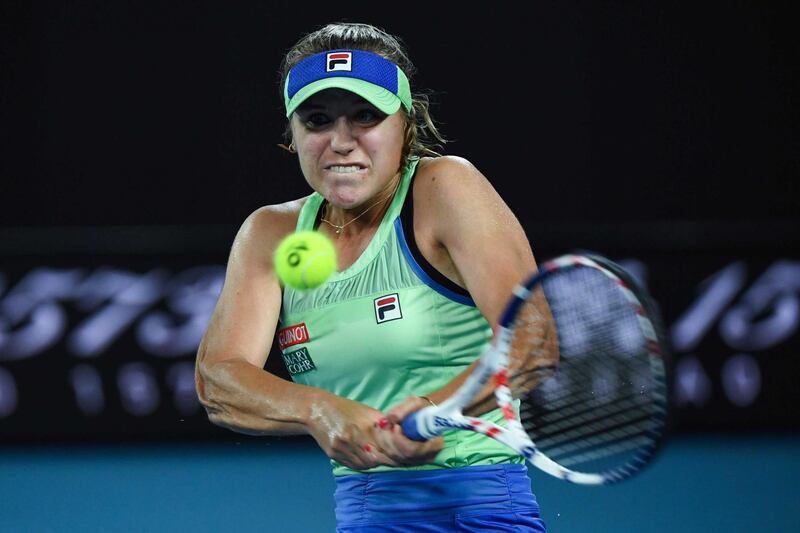 Sofia Kenin of the US hits a return against Spain's Garbine Muguruza during their women's singles final match on day thirteen of the Australian Open tennis tournament in Melbourne on February 1, 2020. (Photo by Saeed KHAN / AFP) / IMAGE RESTRICTED TO EDITORIAL USE - STRICTLY NO COMMERCIAL USE