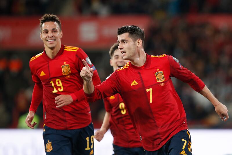 Spain's Alvaro Morata, right, celebrates after scoring against Sweden in the World Cup 2022 Group B qualifier at La Cartuja Stadium in Seville, Spain, Sunday, November 14, 2021.  AP Photo
