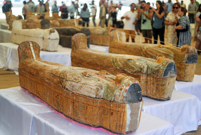 Tourists look at painted ancient coffins at Al-Asasif necropolis, unveiled by Egyptian antiquities officials in the Valley of the Kings in Luxor, Egypt October 19, 2019. REUTERS/Mohamed Abd El Ghany
