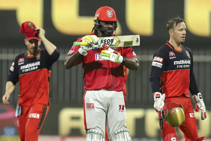 Chris Gayle of Kings XI Punjab raises his bat after scoring a fifty during match 31 of season 13 of the Dream 11 Indian Premier League (IPL) between the Royal Challengers Bangalore and the Kings XI Punjab held at the Sharjah Cricket Stadium, Sharjah in the United Arab Emirates on the 15th October 2020.  Photo by: Deepak Malik  / Sportzpics for BCCI