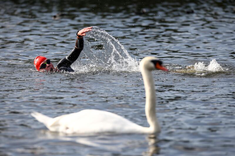 A competitor taking part in the 2021 Children with Cancer UK Swim Serpentine in London on Saturday, September 18. Reuters