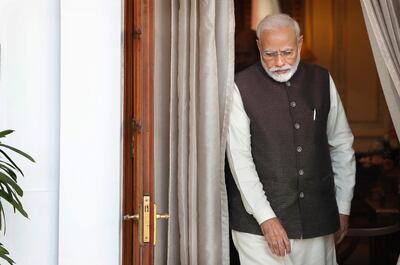 Indian Prime Minister Narendra Modi leaves the room to receive Portuguese President Marcelo Rebelo de Sousa, in New Delhi, India, Friday, Feb. 14, 2020. (AP Photo/Manish Swarup)