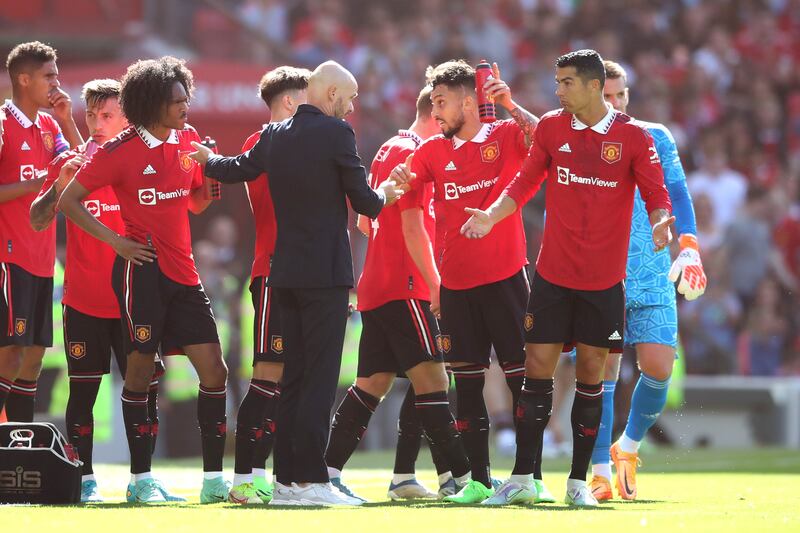 Manchester United manager Erik ten Hag chats with Cristiano Ronaldo at Old Trafford. Getty