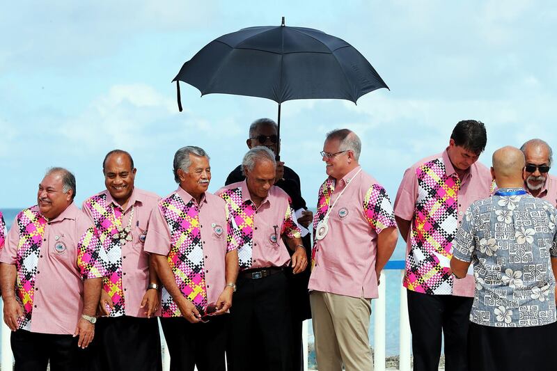 This handout photo taken and released on August 15, 2019 by the Australian Prime Minister's Office shows Australia's Prime Minister Scott Morrison (3rd R) talking with other leaders at the Pacific Islands Forum in Tuvalu.  Australia's Scott Morrison arrived at a meeting of Pacific island leaders in Tuvalu with Canberra's regional leadership in question amid intense scrutiny of his government's climate change policies. - XGTY  -----EDITORS NOTE --- RESTRICTED TO EDITORIAL USE - MANDATORY CREDIT "AFP PHOTO / AUSTRALIAN PRIME MINISTER'S OFFICE " - NO MARKETING - NO ADVERTISING CAMPAIGNS - DISTRIBUTED AS A SERVICE TO CLIENTS - NO ARCHIVES

 / AFP / AUSTRALIAN PRIME MINISTER'S OFFICE / Adam TAYLOR / XGTY  -----EDITORS NOTE --- RESTRICTED TO EDITORIAL USE - MANDATORY CREDIT "AFP PHOTO / AUSTRALIAN PRIME MINISTER'S OFFICE " - NO MARKETING - NO ADVERTISING CAMPAIGNS - DISTRIBUTED AS A SERVICE TO CLIENTS - NO ARCHIVES

