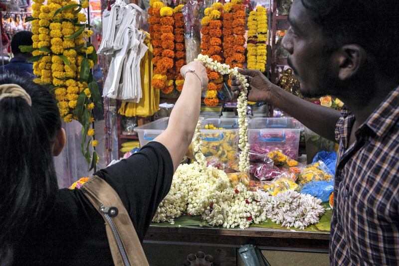 DUBAI, UNITED ARAB EMIRATES. 24 OCTOBER 2019. As the Hindu Festival of Diwali starts in the UAE, devotees flok to the Hindu Temple in Bur Dubai to worship. Adjacent to the Temple is what is commonly refered to “Hindi Lane”, a small corridor of shops selling flowers, offerings and general items for Hindu ceremonies. Diwali, Deepavali or Dipavali is a four-to-five day-long festival of lights, which is celebrated by Hindus, Jains, Sikhs and some Buddhists every autumn in the northern hemisphere. (Photo: Antonie Robertson/The National) Journalist: None. Section: National.
