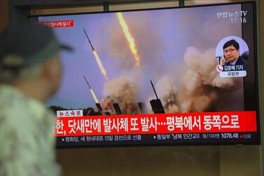 People watch a television news programme showing file footage of North Korea's projectile weapons, at a railway station in Seoul on Thursday. AFP