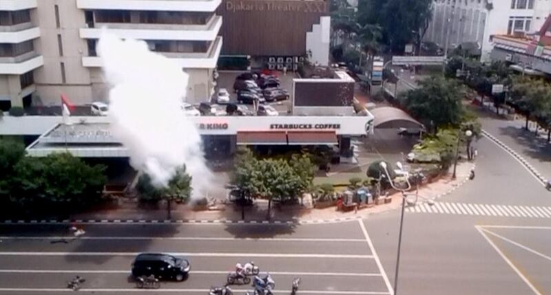 Smoke rises from a bomb blast outside a Starbucks in Jakarta in a still image taken from amateur video shot on January 14, 2016. Amateur video via Reuters TV