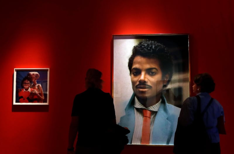 Visitors look at an artwork by Hank Willis Thomas on display at the "Michael Jackson: On The Wall" exhibition at the National Portrait Gallery in London, Britain, on June 27, 2018. Kirsty Wigglesworth / AP Photo