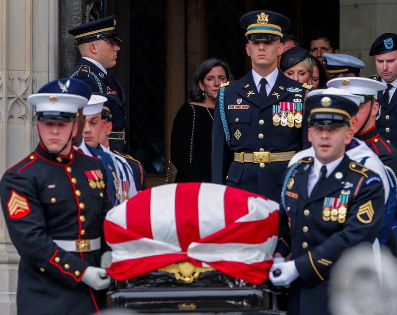 epa06991177 An honor guard carries the casket out after the memorial service for Senator John McCain at the Washington National Cathedral in Washington, DC, USA, 01 September 2018. McCain died 25 August, 2018 from brain cancer at his ranch in Sedona, Arizona, USA. He was a veteran of the Vietnam War, served two terms in the US House of Representatives, and was elected to five terms in the US Senate. McCain also ran for president twice, and was the Republican nominee in 2008.  EPA/ERIK S. LESSER