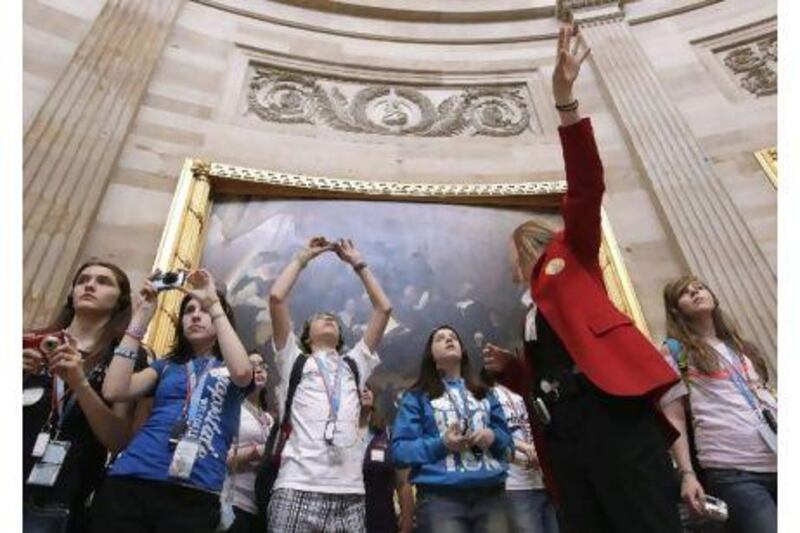 Schoolchildren take a guided tour of the Capitol Rotunda in Washington. A government shutdown would close the Capitol to tourists.