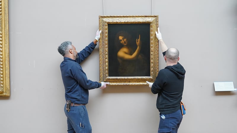 'Saint John the Baptist' was taken down from the wall of the Louvre Museum in Paris on Tuesday, beginning its journey to the UAE. Janelle Meager / The National