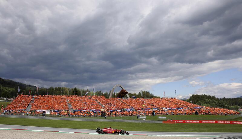 Ferrari's Charles Leclerc drives in front of a stand full of Dutch supporters wearing orange in support of Max Verstappen. AFP