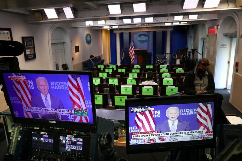 US Democratic presidential candidate Joe Biden is seen delivering remarks through television monitors from the White House Briefing Room in Washington. Reuters