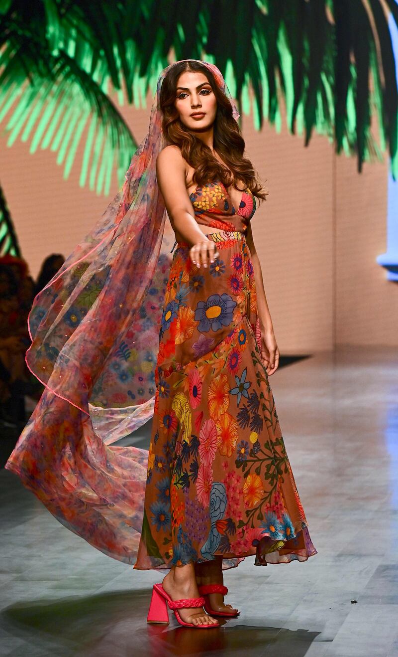 Actress Rhea Chakraborty walks for designer Guapa. AFP