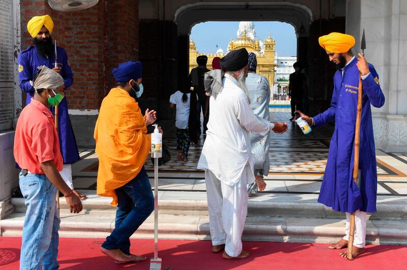 Sikh devotees arrive to pay their respects at the Golden Temple in Amritsar. AFP