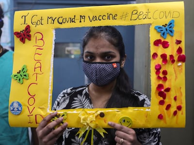A teenager poses for photos after receiving a Covid-19 vaccine dose at a government hospital, in Hyderabad, India. Photo: AP