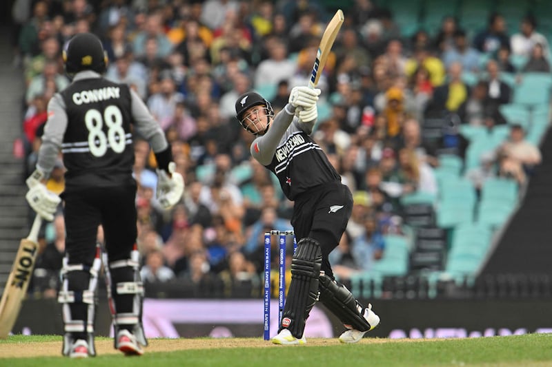 New Zealand's Finn Allen plays a shot over the boundary during the match against Australia. AFP