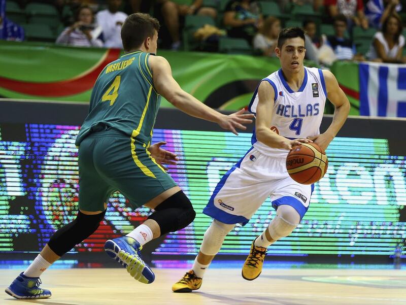Antonis Koniaris, right, of Greece controls the ball against Dejan Vasiljevic of Australia during their Fiba Under 17 World Championship game at Al Shabab Club on August 12, 2014, in Dubai. Francois Nel / Getty Images