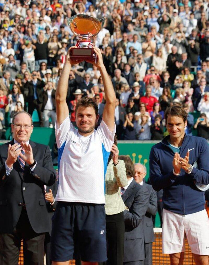 Stanislas Wawrinka lifts the Monte Carlo Masters trophy after his triumph over Roger Federer on Sunday. Claude Paris / AP / April 20, 2014  