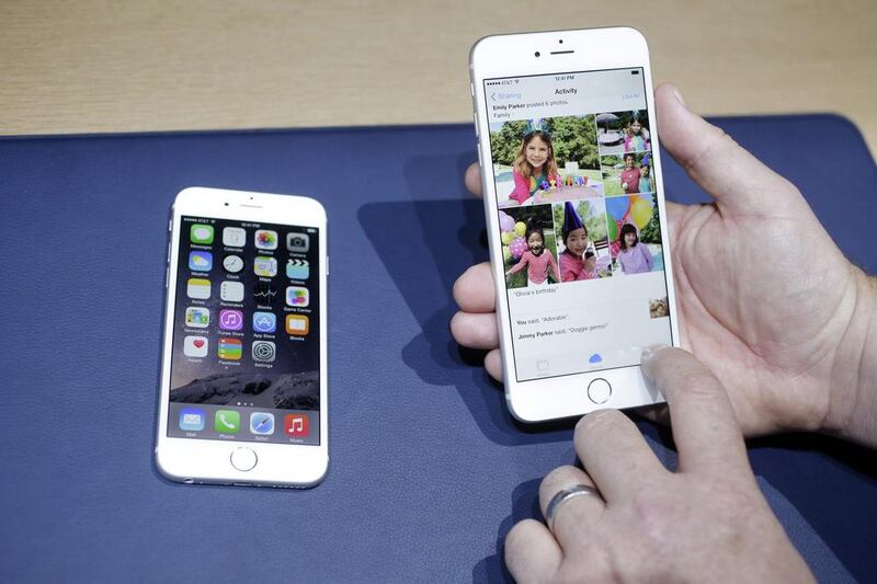 Apple last week unveiled the iPhone 6, left, and its bigger-screen twin the iPhone 6 Plus, sparking a frenzy among excited fans in the UAE. Marcio Jose Sanchez / AP Photo