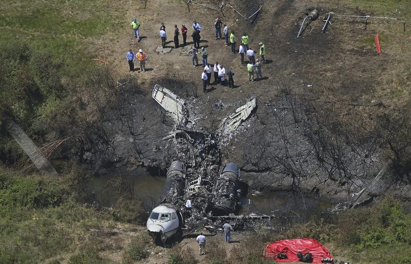 This aerial photo shows wreckage from where a plane plunged down and erupted in flames during a take-off attempt at Hanscom Field in Bedford, Mass. Lewis Katz, co-owner of The Philadelphia Inquirer, and six other people died in the crash. David L. Ryan / AP