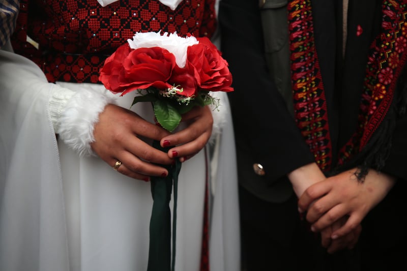 A couple celebrate their wedding at a camp for displaced Palestinians in Deir Al Balah, in the central Gaza Strip, on February 16, 2024. NurPhoto via Getty Images