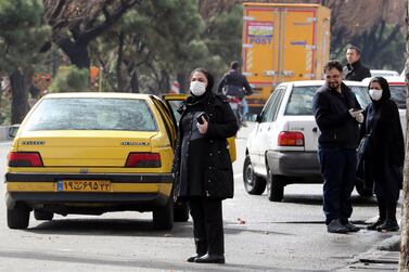 Iranians wearing face masks on the streets of Tehran. EPA 