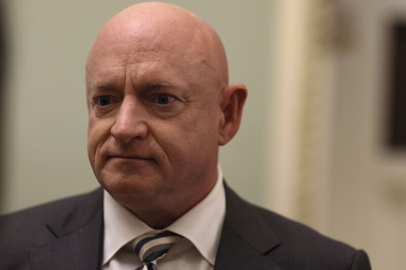 Mark Kelly, a Democratic senator, is banned though his wife, Gabby Giffords, is not. Getty Images / AFP
