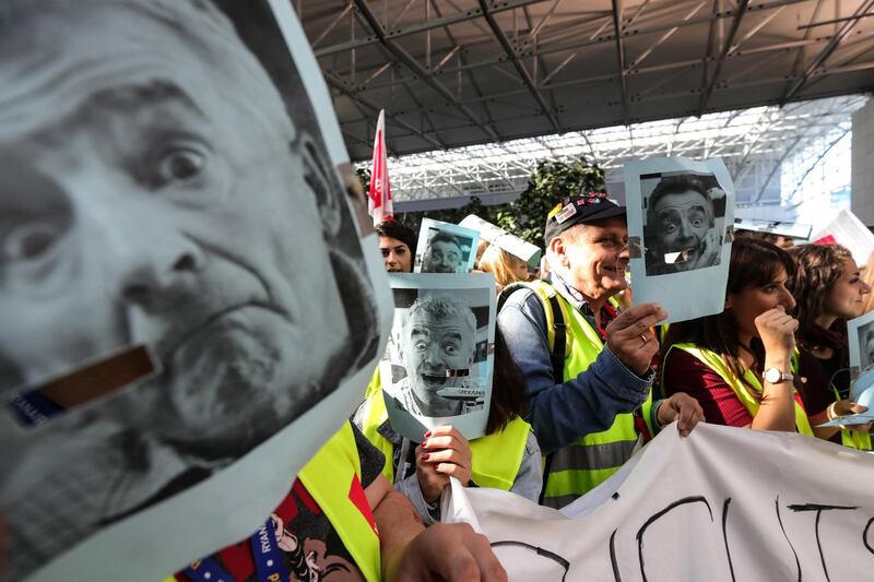 Employees of Ryanair wear masks with the picture of Ryanair CEO O'Leary during a strike at the  airport in Frankfurt Main. EPA