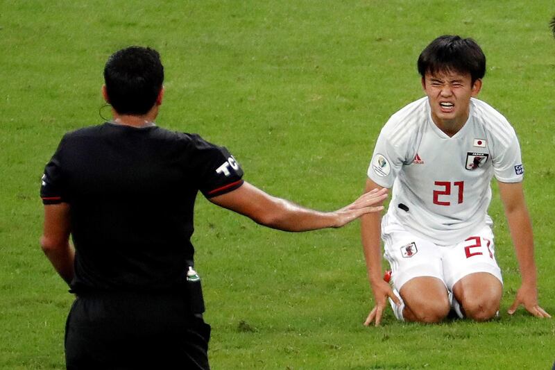 Takefusa Kubo of Japan looks to the referee during the 1-1 draw against Ecuador. AFP