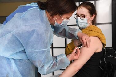 A nurse vaccinates a midwifery student with the AstraZeneca Covid-19 vaccine in France. AFP