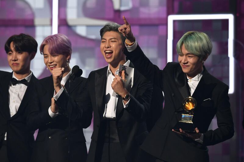 South Korean band BTS presents the award for Best R&B Album during the 61st Annual Grammy Awards on February 10, 2019, in Los Angeles.  / AFP / Robyn Beck
