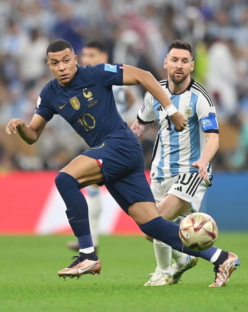 France's  Kylian Mbappe with Lionel Messi of Argentina. Getty