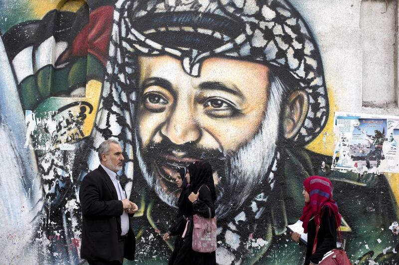 A Gaza City mural of late Palestinian leader Yasser Arafat, who Swiss scientists concluded probably died from polonium poisoning. Mohammed Abed / AFP



