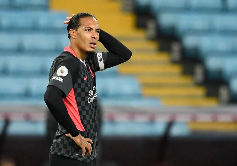 Liverpool's Virgil van Dijk looks dejected after Villa scored their seventh goal. Reuters