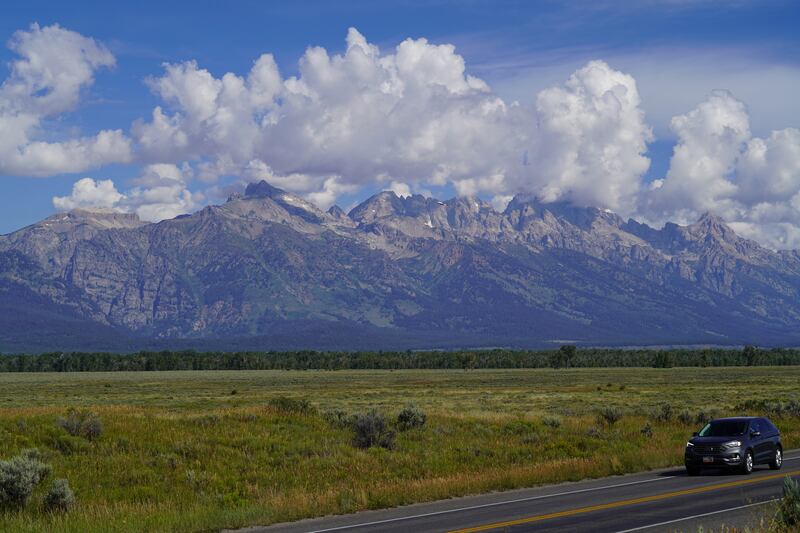 The Grand Teton mountain range rises above Jackson, Wyoming. Willy Lowry / The National