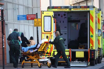 Paramedics transfer a patient outside the Royal London Hospital , amid the coronavirus disease (COVID-19) outbreak, in London, Britain, January 23, 2021. REUTERS/Henry Nicholls