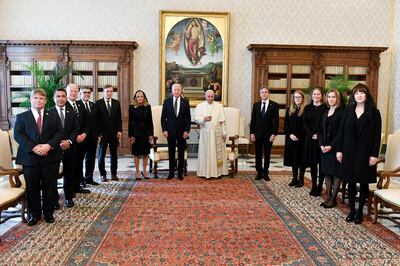 President Joe Biden (centre), first lady, Jill Biden (centre left), Secretary of State Antony Blinken (centre right), and the US delegation pose for a photo with Pope Francis at the Vatican. (Vatican Media via AP)