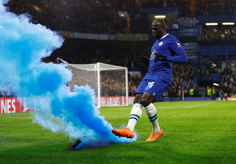 Chelsea's Kalidou Koulibaly kicks a flare off the pitch during their Champions League tie with Borussia Dortmund. Reuters