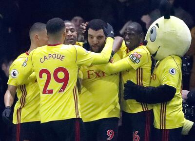 Watford's Troy Deeney, center, celebrates with teammates after scoring his side's first goal during the English Premier League soccer match between Watford and Chelsea at Vicarage Road stadium in London, Monday, Feb. 5, 2018.(AP Photo/Frank Augstein)