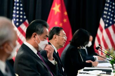 TOPSHOT - The Chinese delegation led by Yang Jiechi (C), director of the Central Foreign Affairs Commission Office and Wang Yi (2nd L), China's Foreign Minister, speak with their US counterparts at the opening session of US-China talks at the Captain Cook Hotel in Anchorage, Alaska on March 18, 2021. China's actions "threaten the rules-based order that maintains global stability," US Secretary of State Antony Blinken said Thursday at the opening of a two-day meeting with Chinese counterparts in Alaska. / AFP / POOL / Frederic J. BROWN
