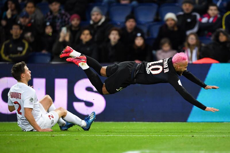 Paris Saint-Germain's Brazilian forward Neymar falls to the ground as he fights for the ball with Montpellier's French defender Arnaud Souquet. AFP